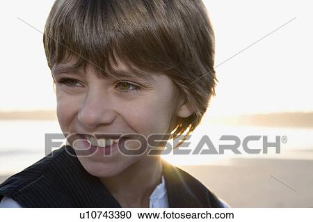 Young boy looking out to sea View Large Photo Image Stock Image - Young boy looking out to sea. Fotosearch