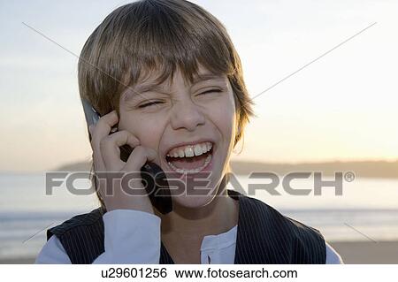 Young boy on cell phone View Large Photo Image Stock Photograph - Young boy on cell phone. Fotosearch