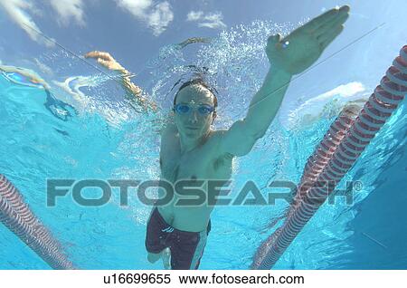 Stock Photography - man swimming in pool. Fotosearch