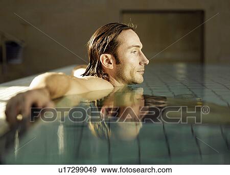 Mature man sitting in swimming pool, side view View Large Photo Image Stock Photo - Mature man sitting in swimming pool, side view. Fotosearch