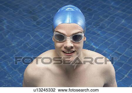 Portrait of a male swimmer in a pool. View Large Photo Image Stock Image - Portrait of a male swimmer in a pool.. Fotosearch
