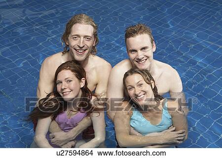 Portrait of four friends in a pool. View Large Photo Image Picture - Portrait of four friends in a pool.. Fotosearch
