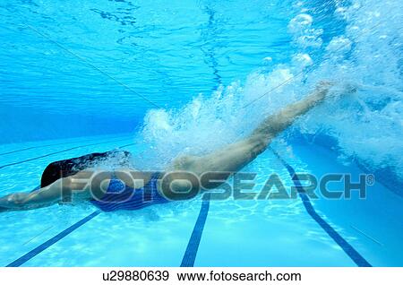 Woman diving in swimming pool, underwater view View Large Photo Image Stock Photo - Woman diving in swimming pool, underwater view. Fotosearch