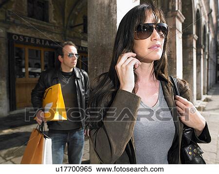 Couple carrying shopping bags. Rialto, Venice, Italy. View Large Photo Image Stock Photography - Couple carrying shopping bags. Rialto, Venice, Italy.. Fotosearch