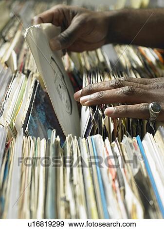 Man selecting record in music shop, close-up View Large Photo Image Stock Photo - Man selecting record in music shop, close-up. Fotosearch