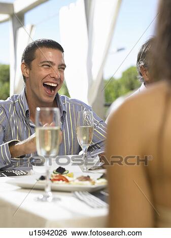 Male laughing at party View Large Photo Image Stock Photograph - Male laughing at party. Fotosearch