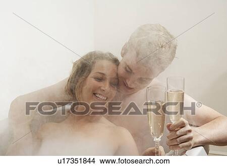 Man and woman drinking in the bath. View Large Photo Image Picture - Man and woman drinking in the bath.. Fotosearch