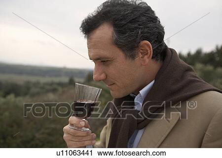 Man smelling wine View Large Photo Image Stock Image - Man smelling wine. Fotosearch