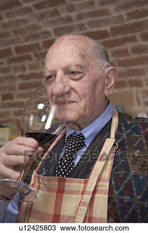 Senior man smelling red wine View Large Photo Image Stock Image - Senior man smelling red wine. Fotosearch
