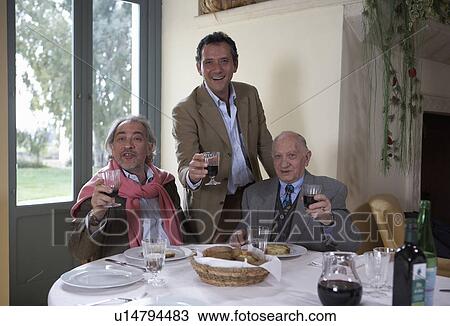 Three generation family raising wineglasses at table, portrait View Large Photo Image Stock Image - Three generation family raising wineglasses at table, portrait. Fotosearch
