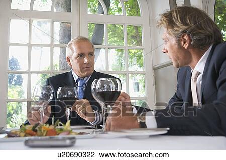 Two businessmen having lunch View Large Photo Image Stock Image - Two businessmen having lunch. Fotosearch