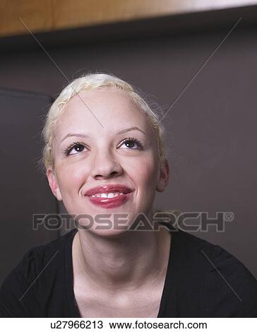Stock Image - Businesswoman at her desk. Fotosearch