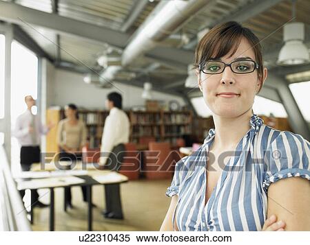 Stock Photography - Businesswoman working in an office. Fotosearch