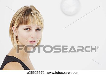 Confident businesswoman looks to camera View Large Photo Image Stock Image - Confident businesswoman looks to camera. Fotosearch