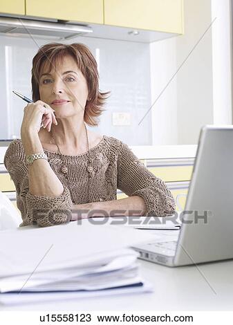 Senior woman running business from home View Large Photo Image Stock Image - Senior woman running business from home. Fotosearch