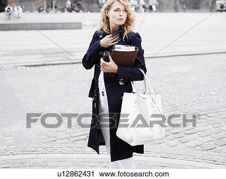 Woman standing outdoors View Large Photo Image Stock Image - Woman standing outdoors . Fotosearch