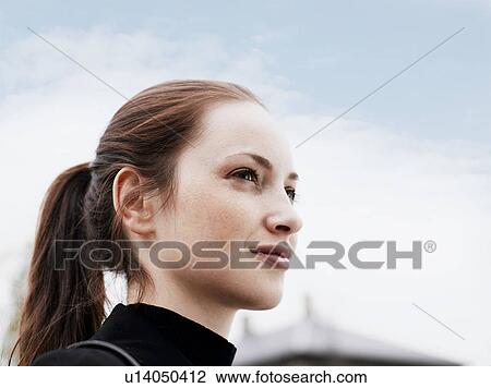 Woman standing outdoors View Large Photo Image Stock Image - Woman standing outdoors . Fotosearch