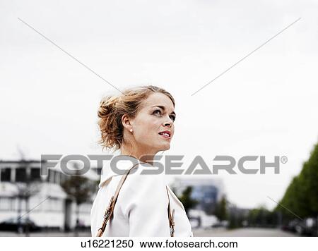 Woman standing outdoors View Large Photo Image Stock Image - Woman standing outdoors . Fotosearch