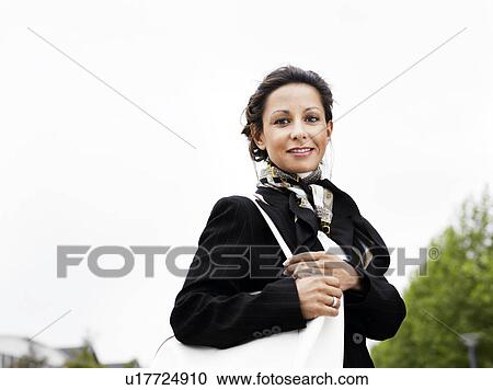 Woman standing outdoors View Large Photo Image Stock Image - Woman standing outdoors . Fotosearch