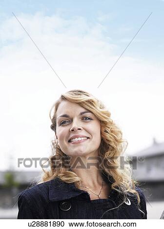 Woman standing outdoors View Large Photo Image Stock Image - Woman standing outdoors . Fotosearch