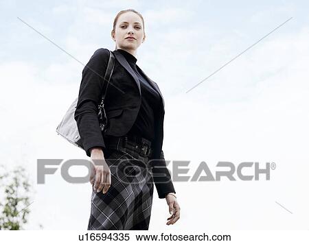 Stock Photography - Woman standing outdoors . Fotosearch