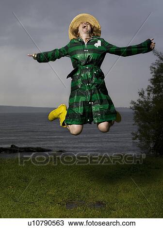 Woman jumping up in the air screaming View Large Photo Image Stock Image - Woman jumping up in the air screaming. Fotosearch