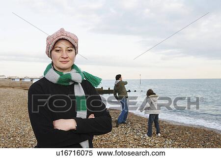 Woman on beach, looks to camera View Large Photo Image Stock Photography - Woman on beach, looks to camera. Fotosearch