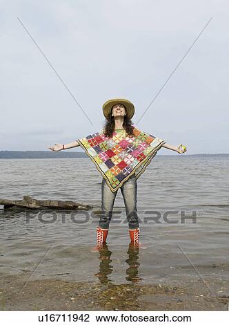 Woman standing in shallow water View Large Photo Image Stock Image - Woman standing in shallow water. Fotosearch