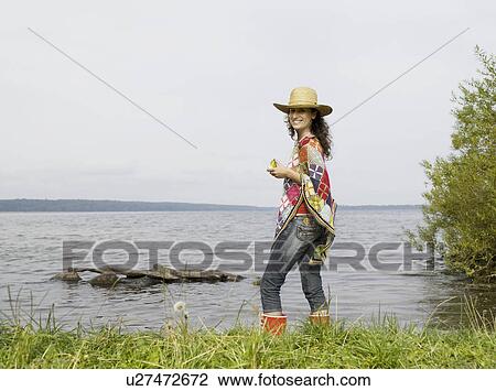 Woman standing in shallow water View Large Photo Image Stock Image - Woman standing in shallow water. Fotosearch
