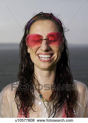 Woman standing in the rain View Large Photo Image Stock Photo - Woman standing in the rain. Fotosearch
