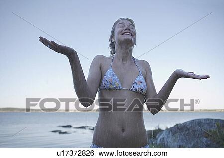 Young Woman in rain wearing bikini. View Large Photo Image Stock Photograph - Young Woman in rain wearing bikini.. Fotosearch