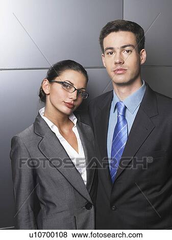 Businessman and businesswoman standing together View Large Photo Image Stock Photo - Businessman and businesswoman standing together. Fotosearch