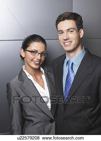 Stock Photo - Businessman and businesswoman standing together. Fotosearch