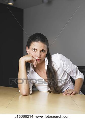 Picture - Businesswoman at her desk. Fotosearch