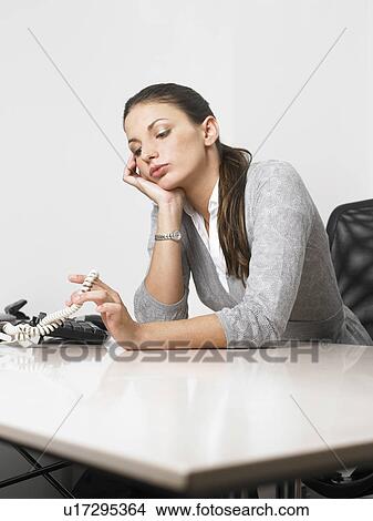 Businesswoman at her desk View Large Photo Image Picture - Businesswoman at her desk. Fotosearch