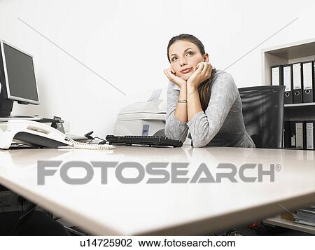 Businesswoman at her desk View Large Photo Image Stock Image - Businesswoman at her desk. Fotosearch