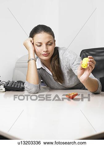 Businesswoman at her desk View Large Photo Image Stock Photograph - Businesswoman at her desk. Fotosearch