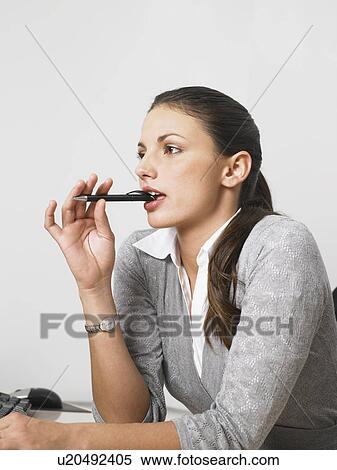 Businesswoman at her desk View Large Photo Image Stock Photography - Businesswoman at her desk. Fotosearch
