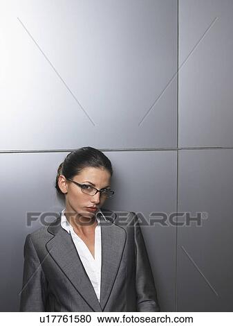 Businesswoman in front of a white wall View Large Photo Image Stock Image - Businesswoman in front of a white wall. Fotosearch
