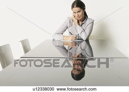 Young business woman at desk with reflections. View Large Photo Image Stock Image - Young business woman at desk with reflections.. Fotosearch