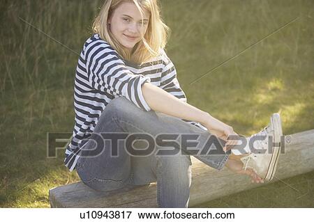Young putting on training shoes. View Large Photo Image Stock Photo - Young putting on training shoes.. Fotosearch