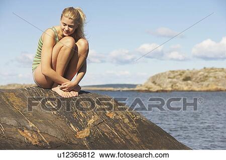Young Woman doing Yoga on rocks. View Large Photo Image Stock Image - Young Woman doing Yoga on rocks.. Fotosearch