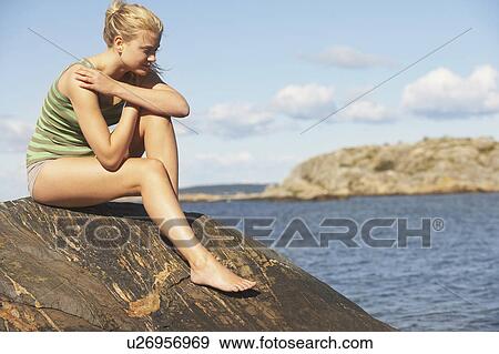 Young Woman doing Yoga on rocks. View Large Photo Image Stock Photo - Young Woman doing Yoga on rocks.. Fotosearch