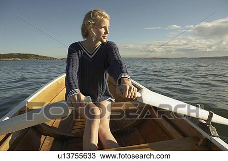 Young woman in rowing boat. View Large Photo Image Stock Image - Young woman in rowing boat.. Fotosearch
