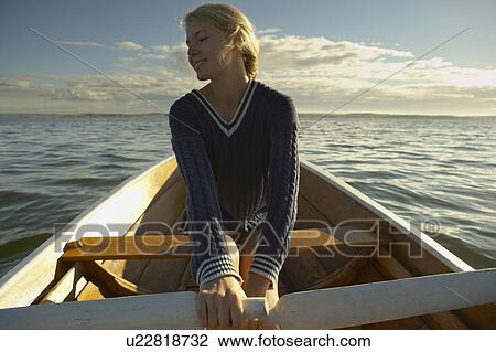 Young woman in rowing boat. View Large Photo Image Stock Image - Young woman in rowing boat.. Fotosearch