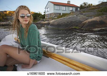 Stock Image - Young Woman in speedboat.. Fotosearch