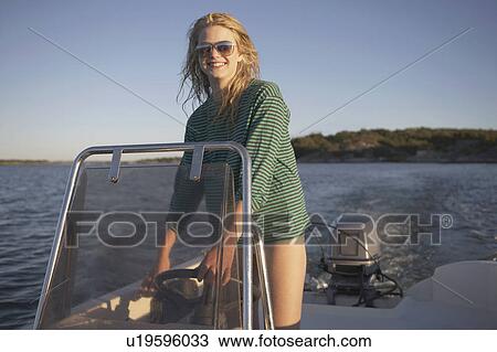 Young Woman in speedboat. View Large Photo Image Stock Image - Young Woman in speedboat.. Fotosearch
