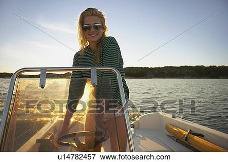 Young Woman in speedboat. View Large Photo Image Stock Photo - Young Woman in speedboat.. Fotosearch