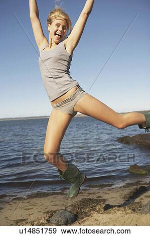 Stock Photo - Young Woman in Wellingtons.. Fotosearch