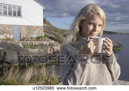 Young Woman relaxing on jetty. View Large Photo Image Stock Photography - Young Woman relaxing on jetty.. Fotosearch